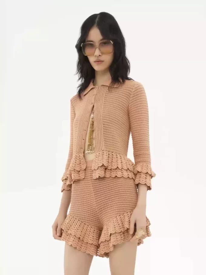 Fitted ruffled cardigan in crochet knit Fitted ruffled cardigan in crochet knit