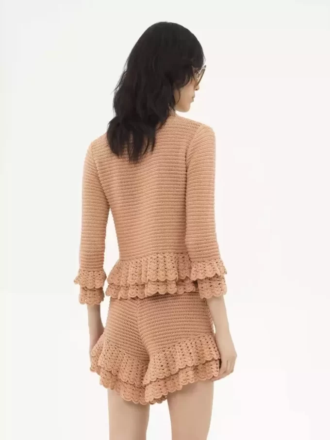 Fitted ruffled cardigan in crochet knit Fitted ruffled cardigan in crochet knit