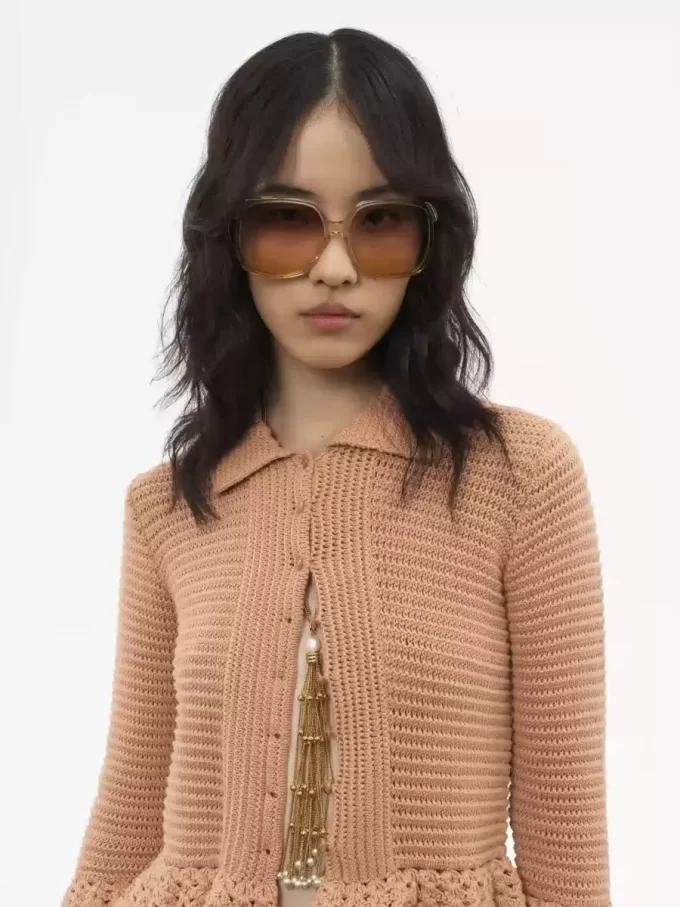 Fitted ruffled cardigan in crochet knit Fitted ruffled cardigan in crochet knit