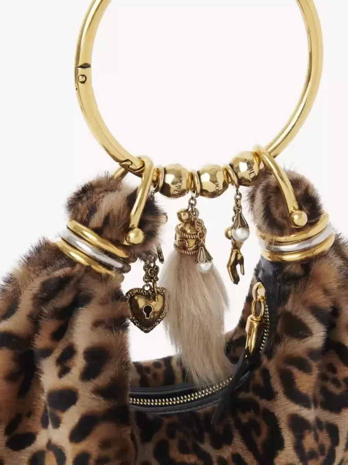 Mini Bracelet Hobo bag in leopard-print shearling Mini Bracelet Hobo bag in leopard-print shearling