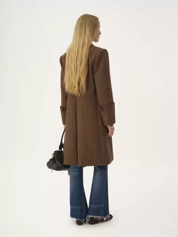 Riding coat in houndstooth wool Riding coat in houndstooth wool