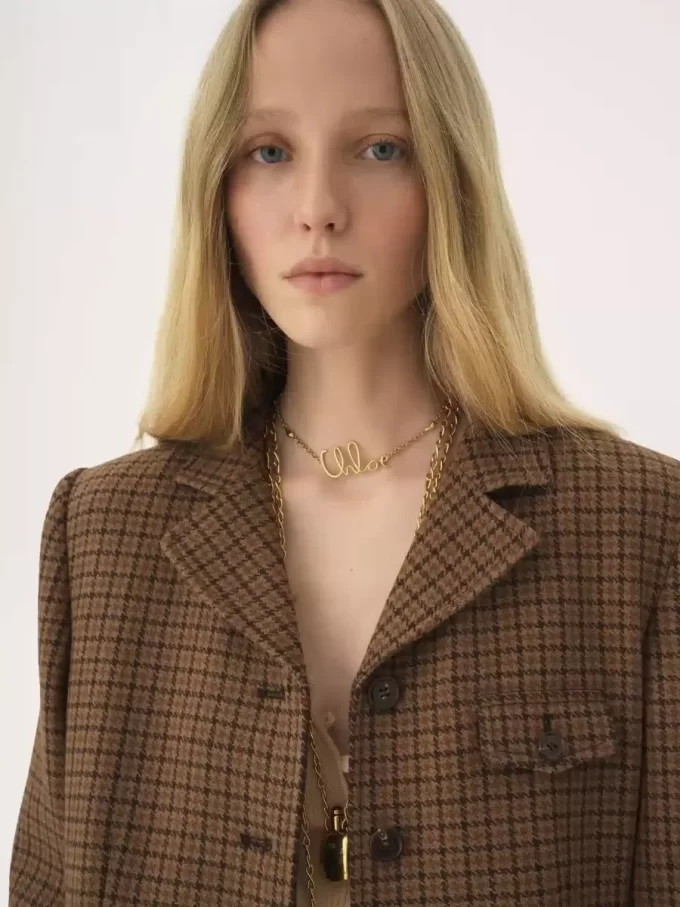 Riding coat in houndstooth wool Riding coat in houndstooth wool