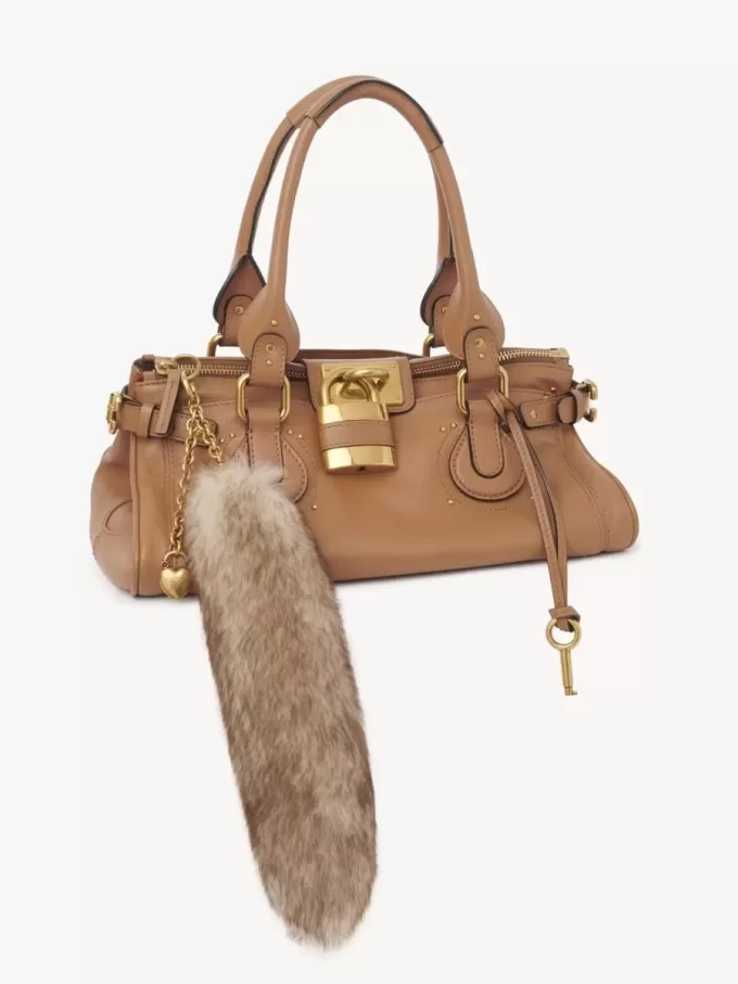 The Treasure Tails charm in shearling The Treasure Tails charm in shearling