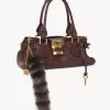 The Treasure Tails charm in shearling The Treasure Tails charm in shearling